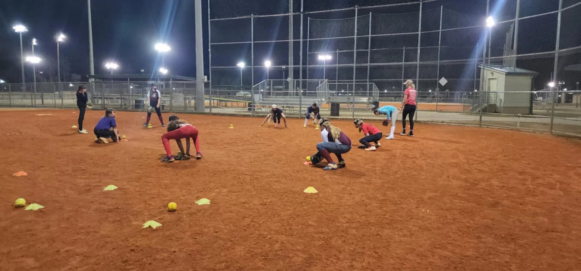 Softball team participating in a Next Level Performance team-building clinic